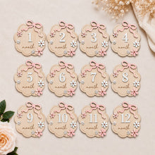 Load image into Gallery viewer, Babymoon Wooden Baby Monthly Milestone Cards Sign Set for Baby Photoshoot Props | 1-12 Months Interchangeable Number Tiles Prop Board with Glue Dots Product Photoshoot| Baby Boys &amp; Girl’s Gift – Bow Design
